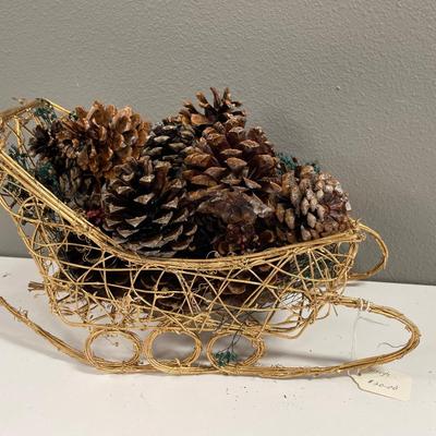 Tote of 5 of these pinecone and sleigh decor