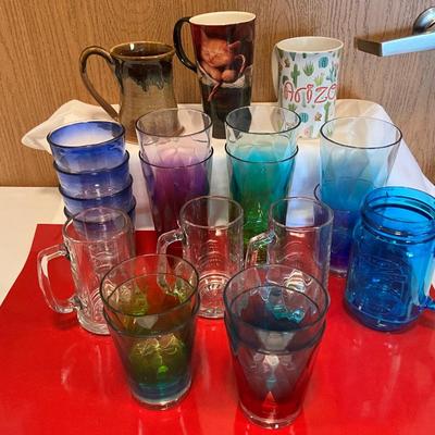 Variety of hard plastic glasses, glass beer mugs, coffee mugs