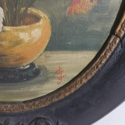 Two matching Antique original paintings in antique oval frames