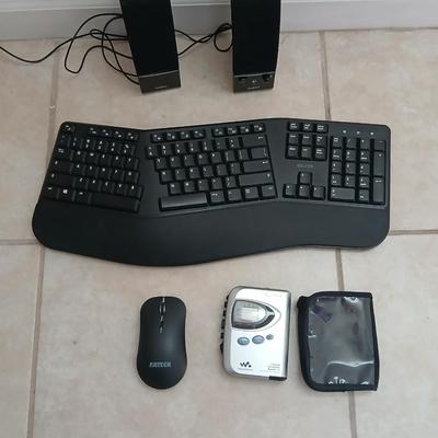 Sony Walkman with case, Insigna Computer speakers, Del Ton ergonomic wireless Keyboard and wireless Arteck mouse