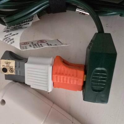 Light bulb storage box with Two extension cords and a blacklight flash light