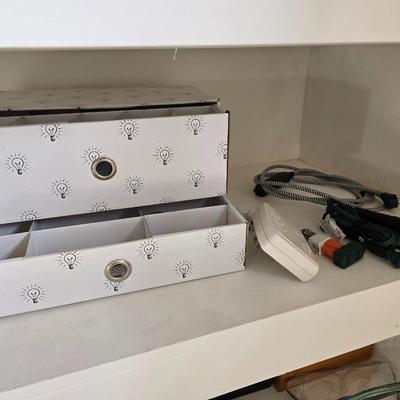 Light bulb storage box with Two extension cords and a blacklight flash light
