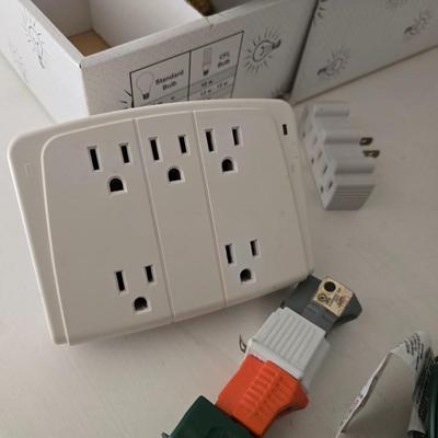Light bulb storage box with Two extension cords and a blacklight flash light
