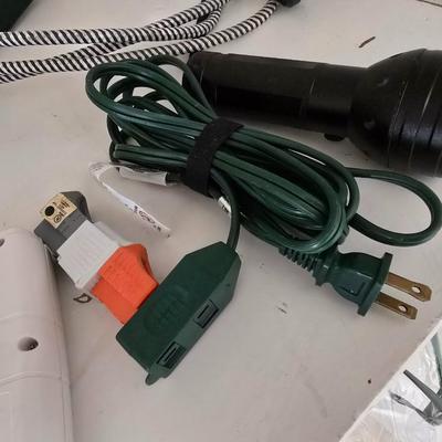 Light bulb storage box with Two extension cords and a blacklight flash light