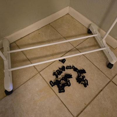 Portable Clothes Rack on casters with an assortment of Hangers
