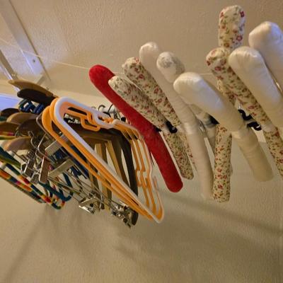 Portable Clothes Rack on casters with an assortment of Hangers
