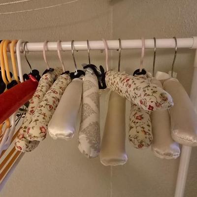 Portable Clothes Rack on casters with an assortment of Hangers