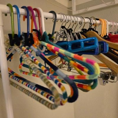 Portable Clothes Rack on casters with an assortment of Hangers