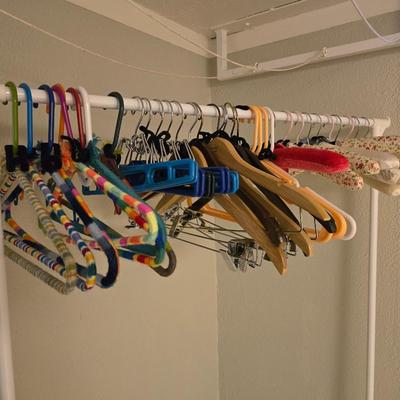 Portable Clothes Rack on casters with an assortment of Hangers