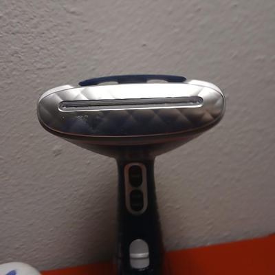 Conair Corporation turbo extreme steam handheld clothes steamer and a Conair fabric shaver