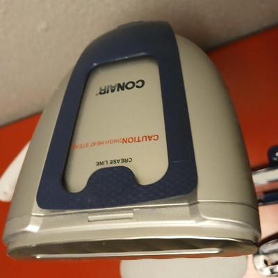 Conair Corporation turbo extreme steam handheld clothes steamer and a Conair fabric shaver