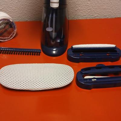 Conair Corporation turbo extreme steam handheld clothes steamer and a Conair fabric shaver
