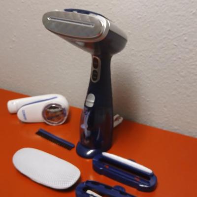 Conair Corporation turbo extreme steam handheld clothes steamer and a Conair fabric shaver