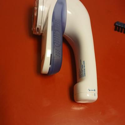 Conair Corporation turbo extreme steam handheld clothes steamer and a Conair fabric shaver