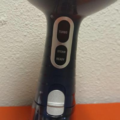 Conair Corporation turbo extreme steam handheld clothes steamer and a Conair fabric shaver
