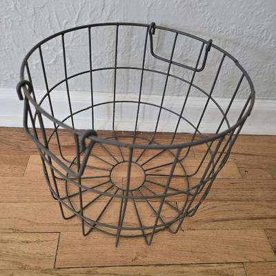 Two vintage metal baskets