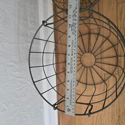 Two vintage metal baskets