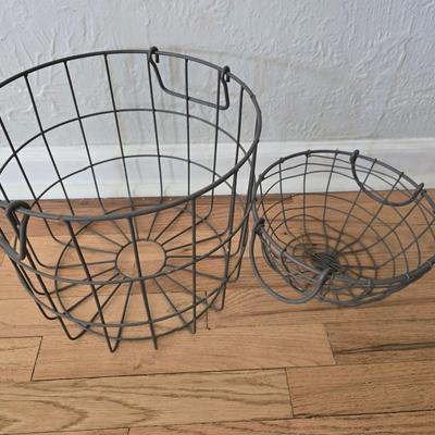 Two vintage metal baskets