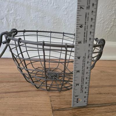 Two vintage metal baskets