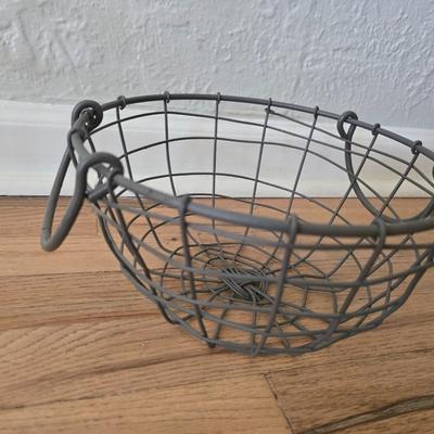 Two vintage metal baskets