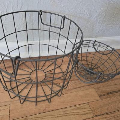 Two vintage metal baskets