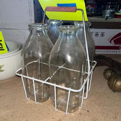 Milk jars in wire carrier