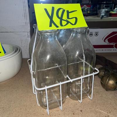 Milk jars in wire carrier