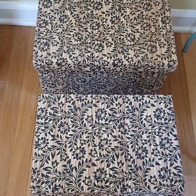 Two matching nesting fabric covered storage boxes with handles
