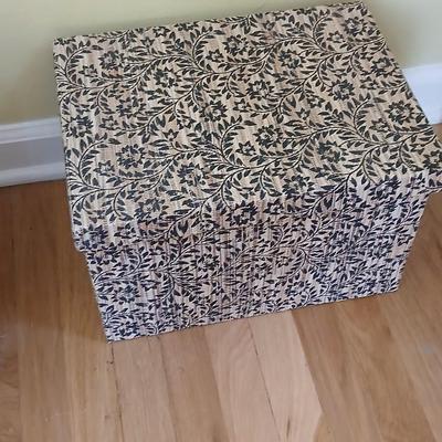 Two matching nesting fabric covered storage boxes with handles