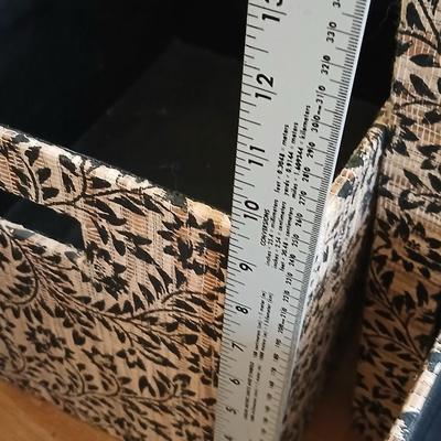 Two matching nesting fabric covered storage boxes with handles