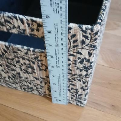 Two matching nesting fabric covered storage boxes with handles