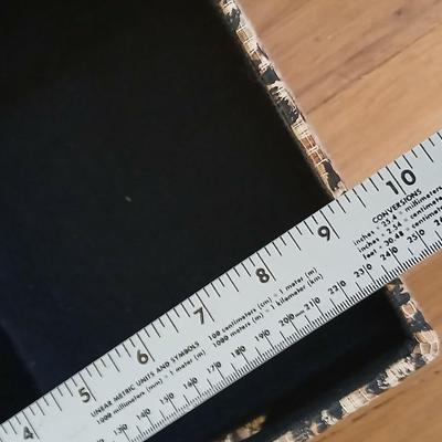 Two matching nesting fabric covered storage boxes with handles