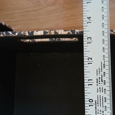 Two matching nesting fabric covered storage boxes with handles