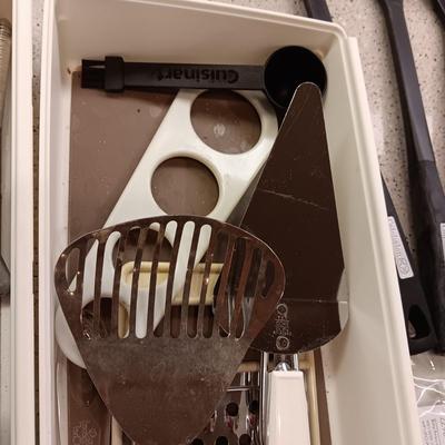 A VARIETY OF KITCHEN UTENSILS