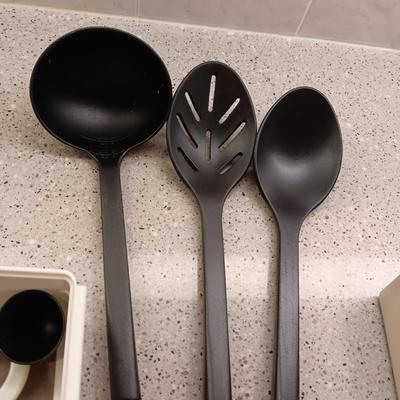 A VARIETY OF KITCHEN UTENSILS
