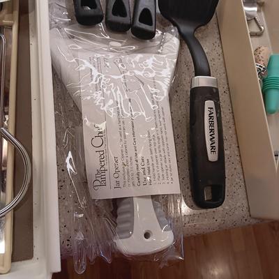 A VARIETY OF KITCHEN UTENSILS