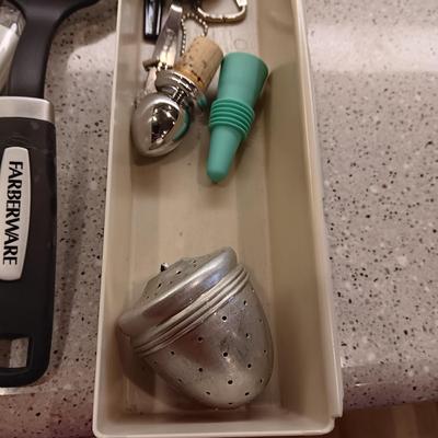 A VARIETY OF KITCHEN UTENSILS