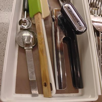 A VARIETY OF KITCHEN UTENSILS