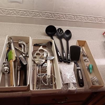 A VARIETY OF KITCHEN UTENSILS