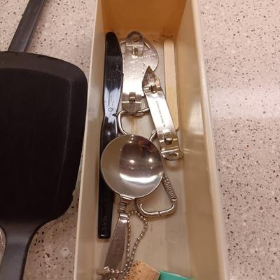 A VARIETY OF KITCHEN UTENSILS
