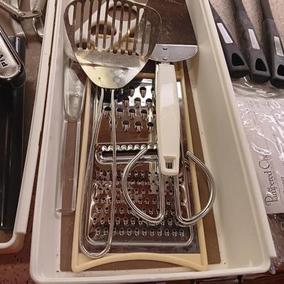 A VARIETY OF KITCHEN UTENSILS