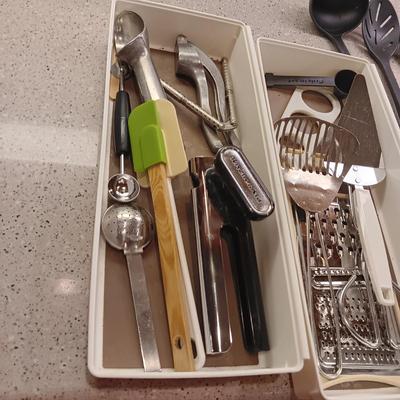 A VARIETY OF KITCHEN UTENSILS