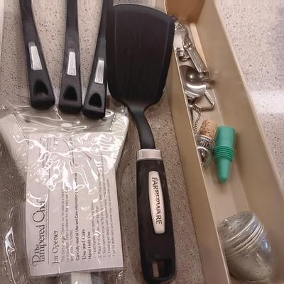 A VARIETY OF KITCHEN UTENSILS