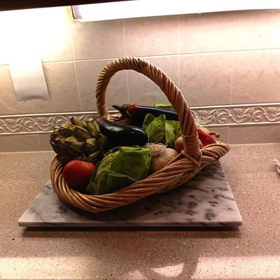 REALISTIC VEGETABLES IN A BASKET AND A GRANITE CUTTING BOARD