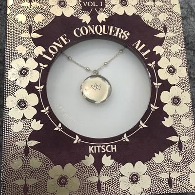 Kitsch Love conquers all gold, toned locket necklace