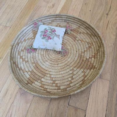 Handwoven basket and vintage needlepoint pin cushion