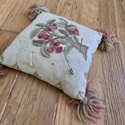Handwoven basket and vintage needlepoint pin cushion