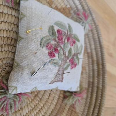 Handwoven basket and vintage needlepoint pin cushion