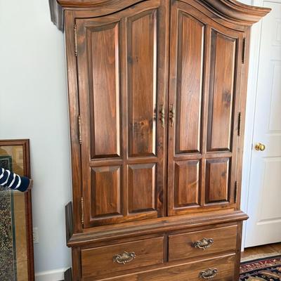 Beautiful armoire with a ton of clothing or linen storage