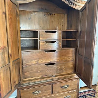 Beautiful armoire with a ton of clothing or linen storage